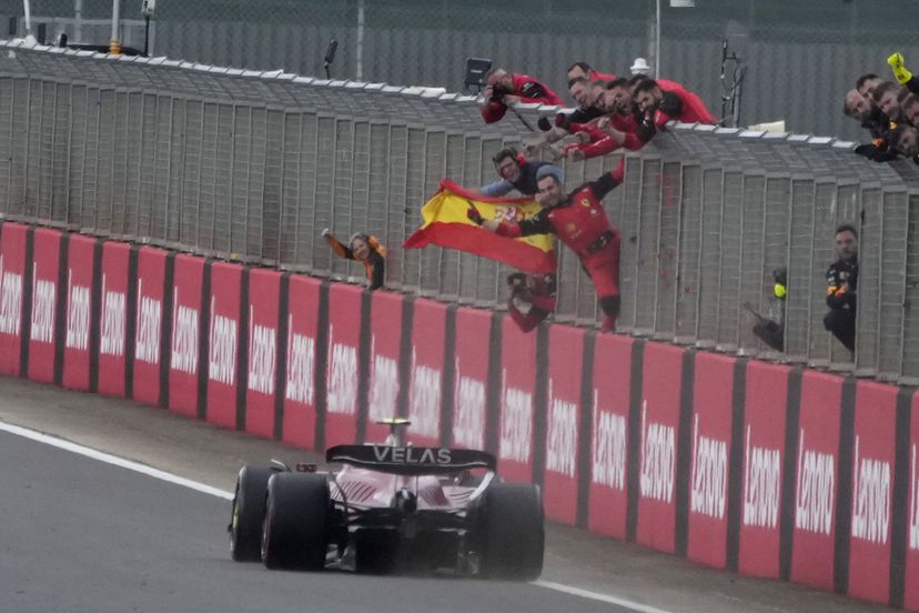 Ferrari driver Carlos Sainz of Spain crosses the finish line to win the British Formula One Grand Prix at the Silverstone circuit, in Silverstone, England, Sunday, July 3, 2022. (AP Photo/Frank Augstein)